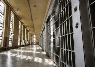 Image of jail cells via Shutterstock