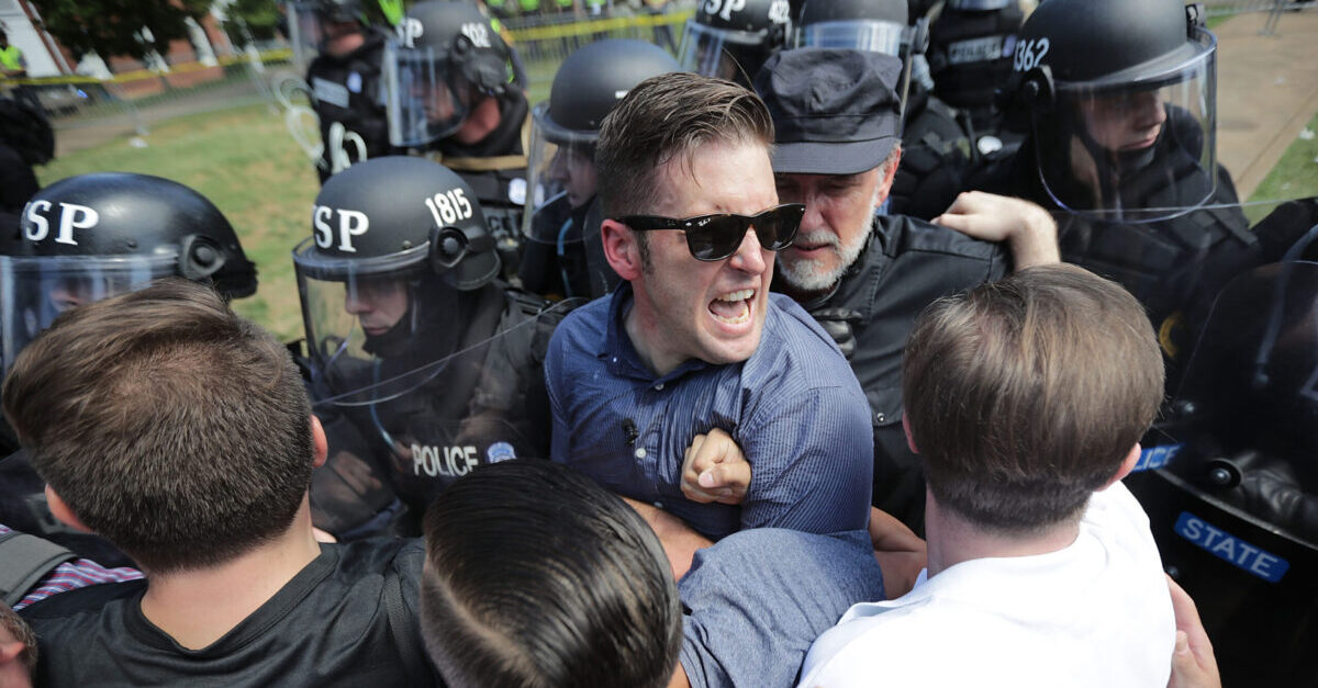 CHARLOTTESVILLE, VA - AUGUST 12: White nationalist Richard Spencer (C) and his supporters clash with Virginia State Police in Emancipation Park after the "Unite the Right" rally was declared an unlawful gathering August 12, 2017 in Charlottesville, Virginia. Hundreds of white nationalists, neo-Nazis and members of the "alt-right" clashed with anti-fascist protesters and police as they attempted to hold a rally in Emancipation Park, where a statue of Confederate General Robert E. Lee is slated to be removed.
