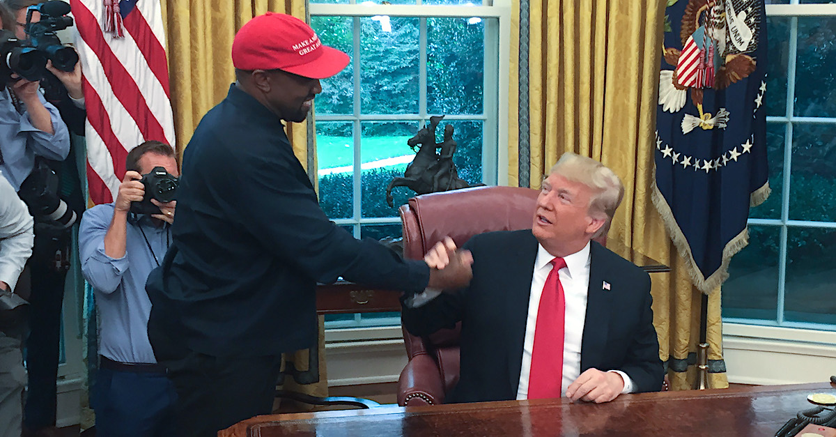 (Files) in this file photo US President Donald Trump meets with rapper Kanye West in the Oval Office of the White House in Washington, DC, October 11, 2018. - Kanye West, the entertainment mogul who urges listeners in one song to "reach for the stars, so if you fall, you land on a cloud," announced July 4, 2020, he is challenging Donald Trump for the US presidency in 2020.