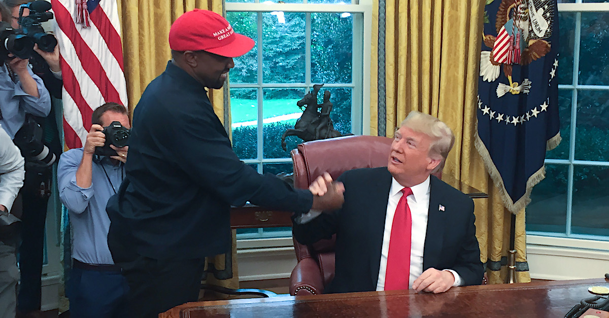 (Files) in this file photo US President Donald Trump meets with rapper Kanye West in the Oval Office of the White House in Washington, DC, October 11, 2018. - Kanye West, the entertainment mogul who urges listeners in one song to "reach for the stars, so if you fall, you land on a cloud," announced July 4, 2020, he is challenging Donald Trump for the US presidency in 2020. 