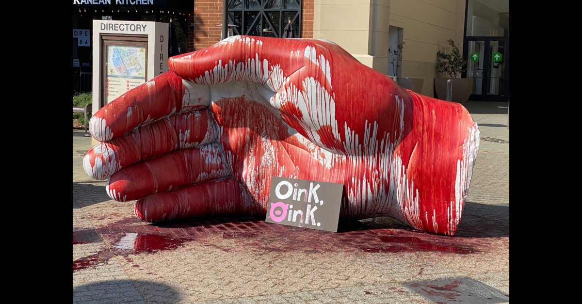 A red substance covered a large hand statute at the Santa Rosa Plaza mall in Santa Rosa, California on April 17, 2021. The substance was animal's blood, police say. There was a sign left in front of it. It stated, "Oink, oink." The second O was stylized to resemble a pig.