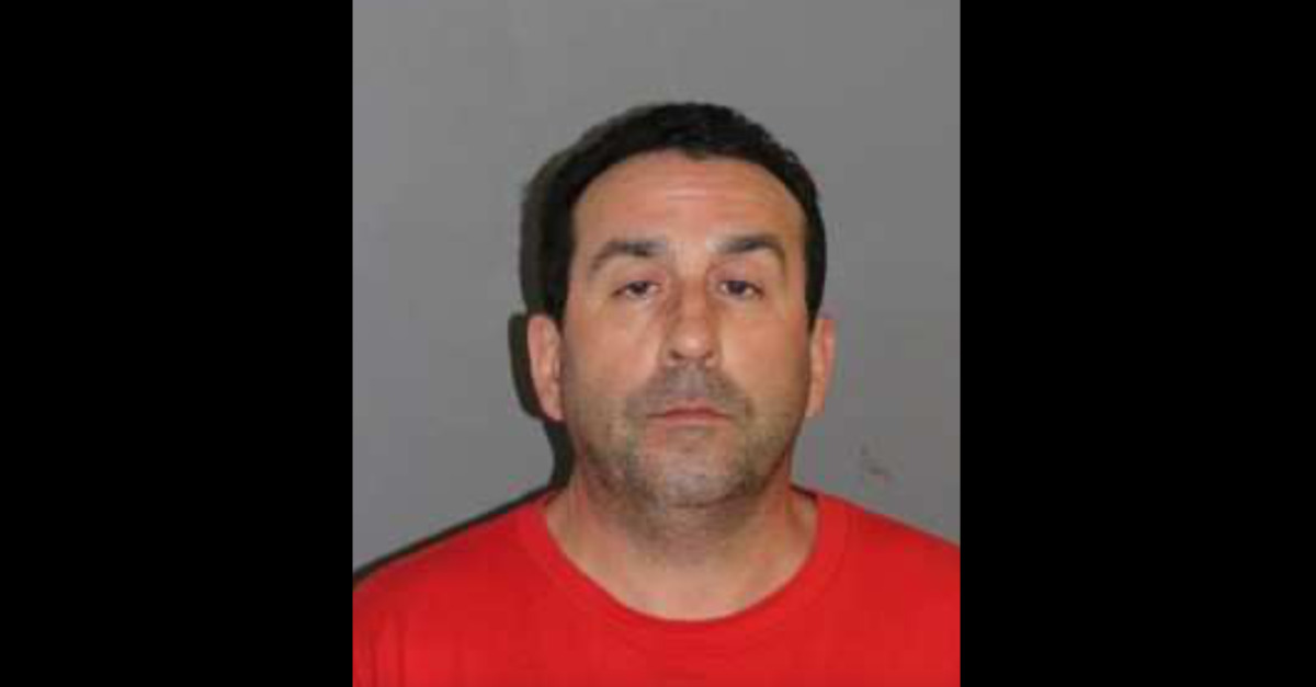 Daniel Perreault appears in a mugshot