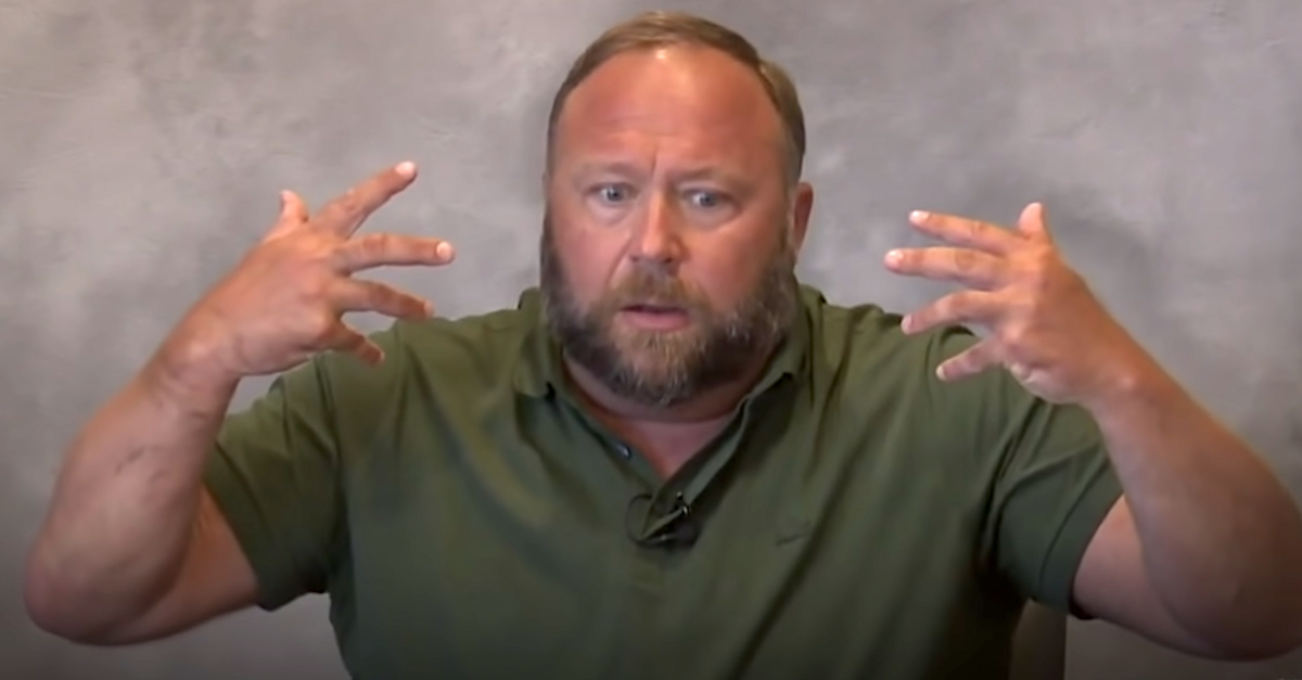 Alex Jones appears in a freeze frame extracted from a deposition video. The recording was posted to YouTube by the online news outlet HuffPost.