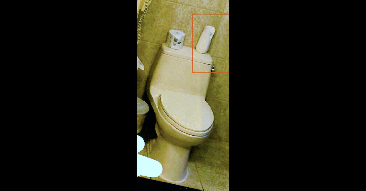 Prosecutors said a device that looked like an air freshener on a toilet was really a hidden camera. (Image via federal court documents.)