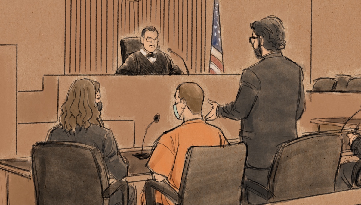 A courtroom sketch shows Derek Chauvin, seated in orange prison garb, agreeing to plead guilty to federal civil rights crimes. (Art by Cedric Hohnstadt.)