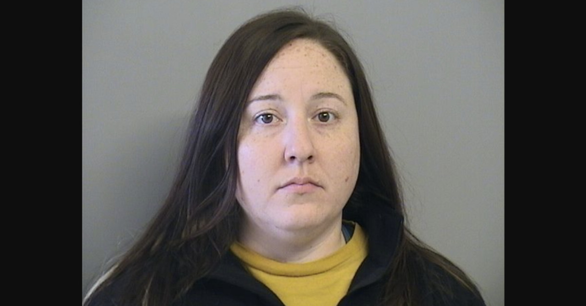 Christin Covel appears in a mugshot