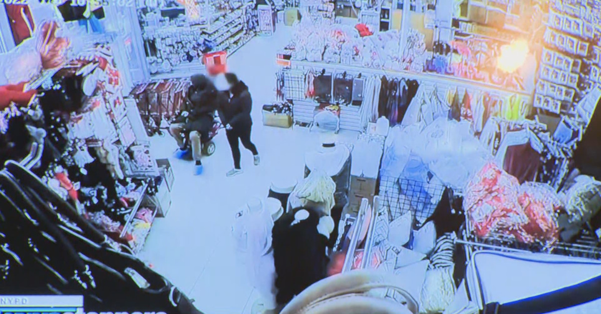 An alleged murderer sits on a human leg in a store
