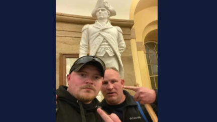 A picture shows Jacob Fracker (L), Thomas Robertson (R), ex-cops from Virginia who stormed the Capitol on Jan. 6.