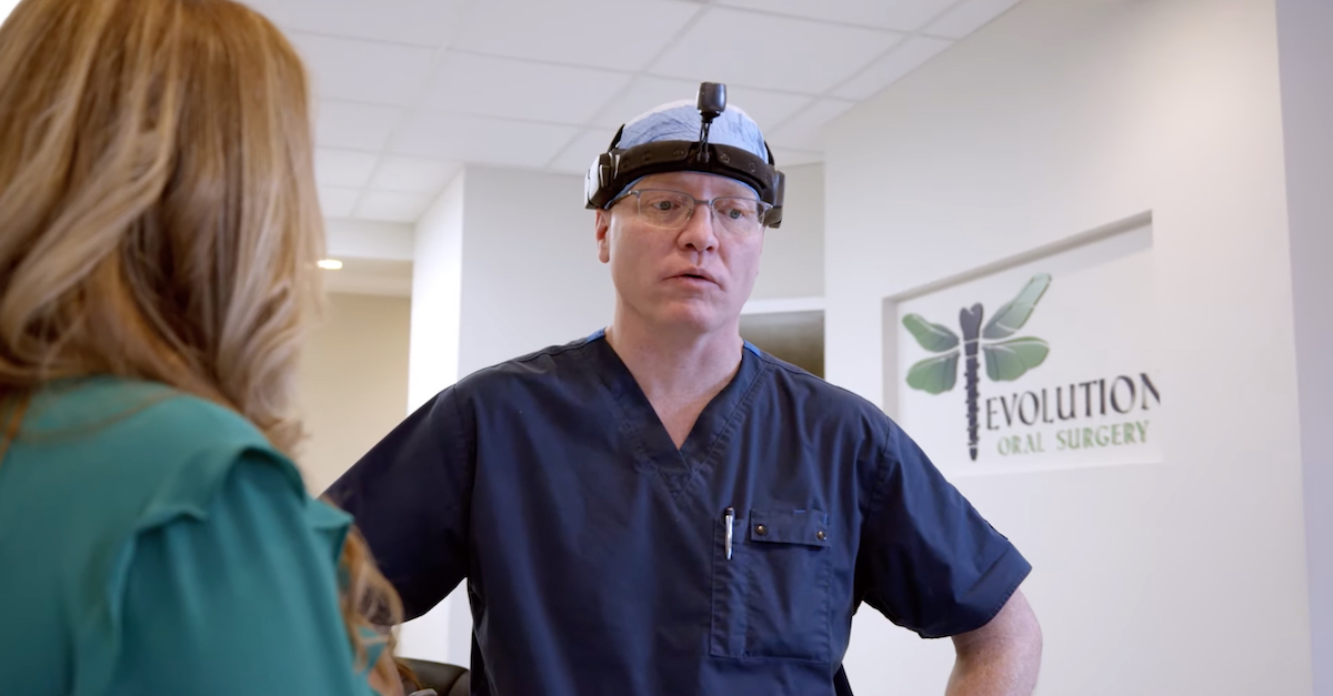 Dr. James Ryan appears in a YouTube screengrab from a video posted online by Evolution Oral Surgery and embedded within the organization's website.
