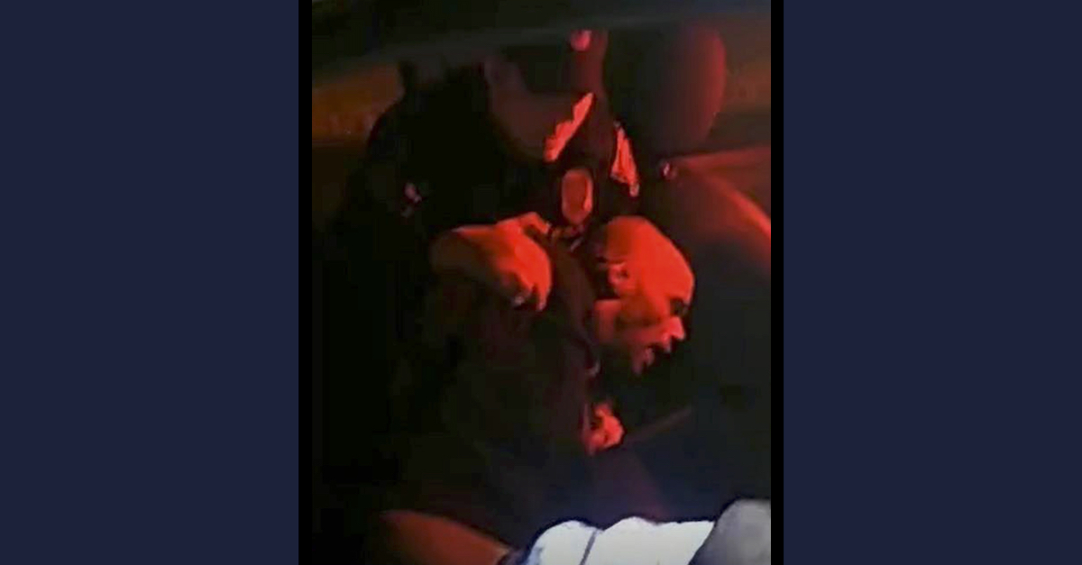 Paul Johnson (bottom) was captured on body camera video as he was being restrained by an Indianapolis police officer. (Image via court records/Officer Jared Henry’s body cam.)