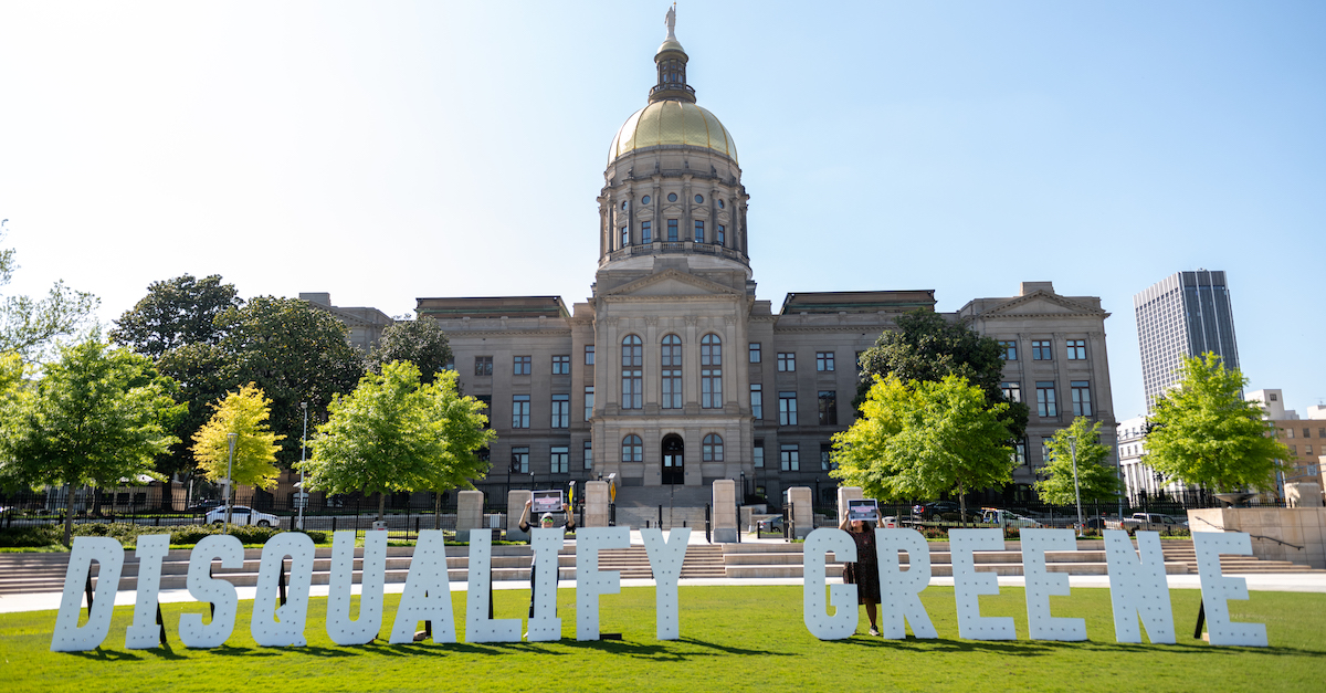 Georgians Spell Out "Disqualify Greene" In Front Of The Georgia State Capitol In Support Of The Challenge To Marjorie Taylor Greene's Qualification For The Ballot Under The Insurrection Clause Of The 14th Amendment