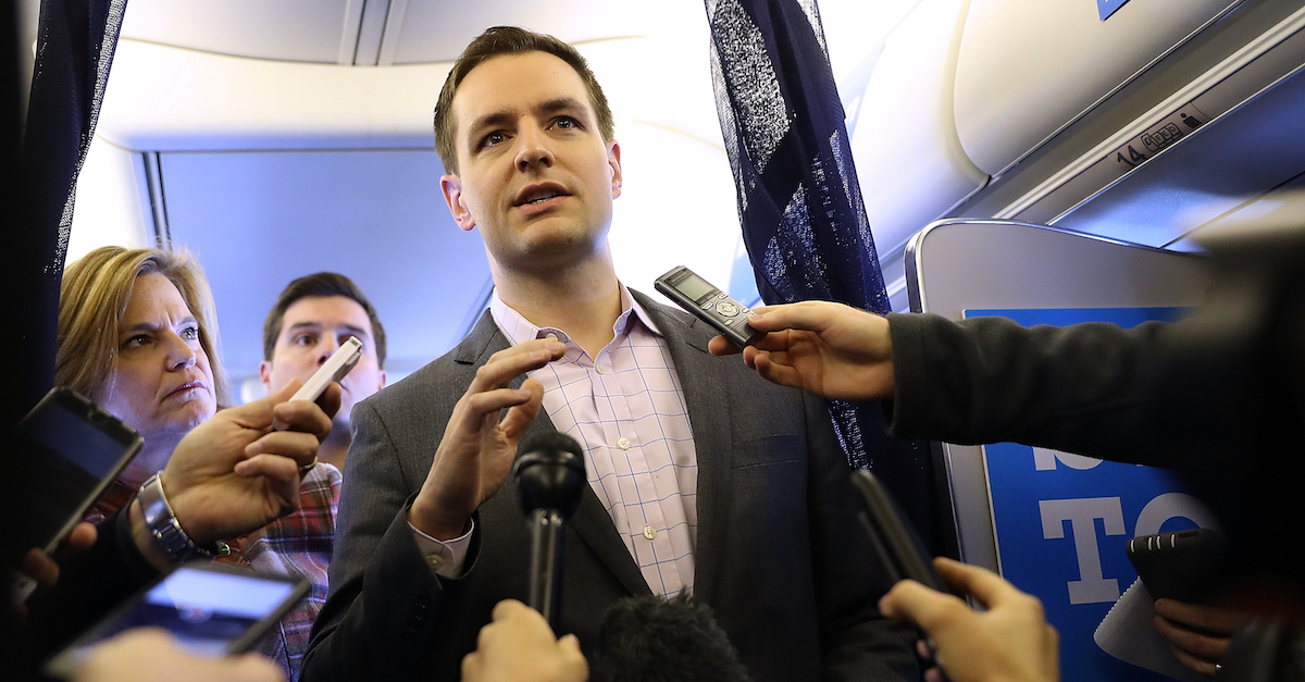 Robby Mook speaks aboard Hillary Clinton's campaign plane while traveling to Cedar Rapids, Iowa October 28, 2016. (Photo by Justin Sullivan/Getty Images.)
