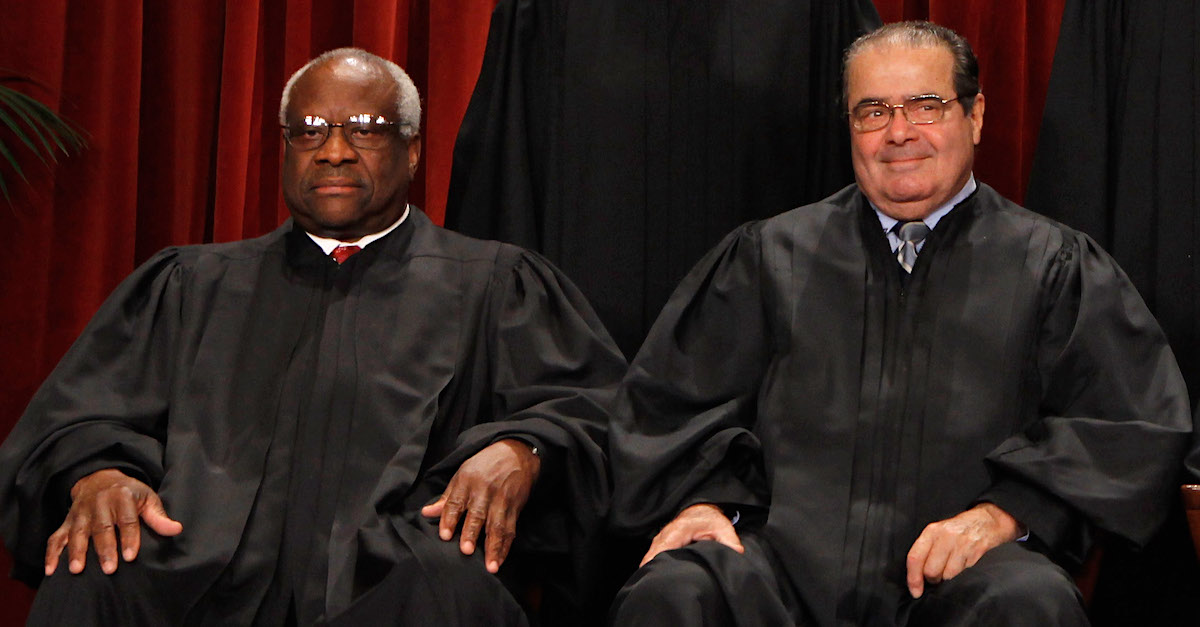 Justices Clarence Thomas and Antonin Scalia were seated together on Oct. 8, 2010, during the Supreme Court's formal portrait.