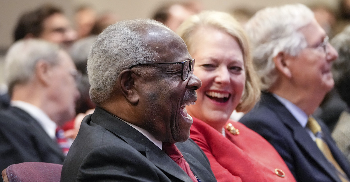 Justice Clarence Thomas sits with his wife, conservative activist Virginia Thomas, while he waits to speak at the Heritage Foundation on October 21, 2021 in Washington, D.C. (Photo by Drew Angerer/Getty Images.)