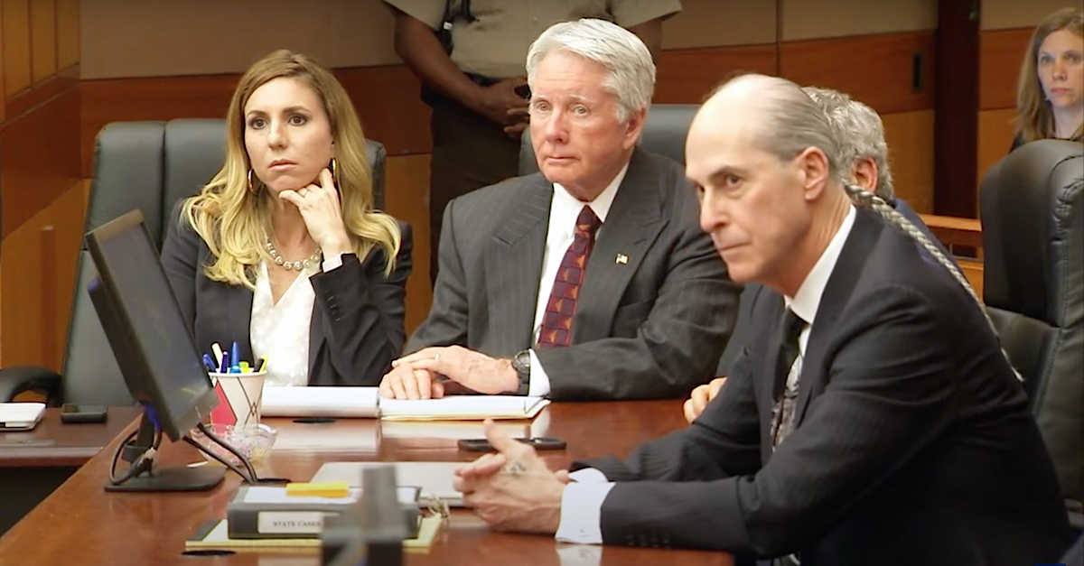 Tex McIver (center) listened as his jury was polled in 2018. His attorneys Amanda Clark Palmer and Bruce Harvey flanked him; co-counsel Don Samuel was barely visible between Harvey and McIver. (Image via WAGA-TV/YouTube screengrab.)