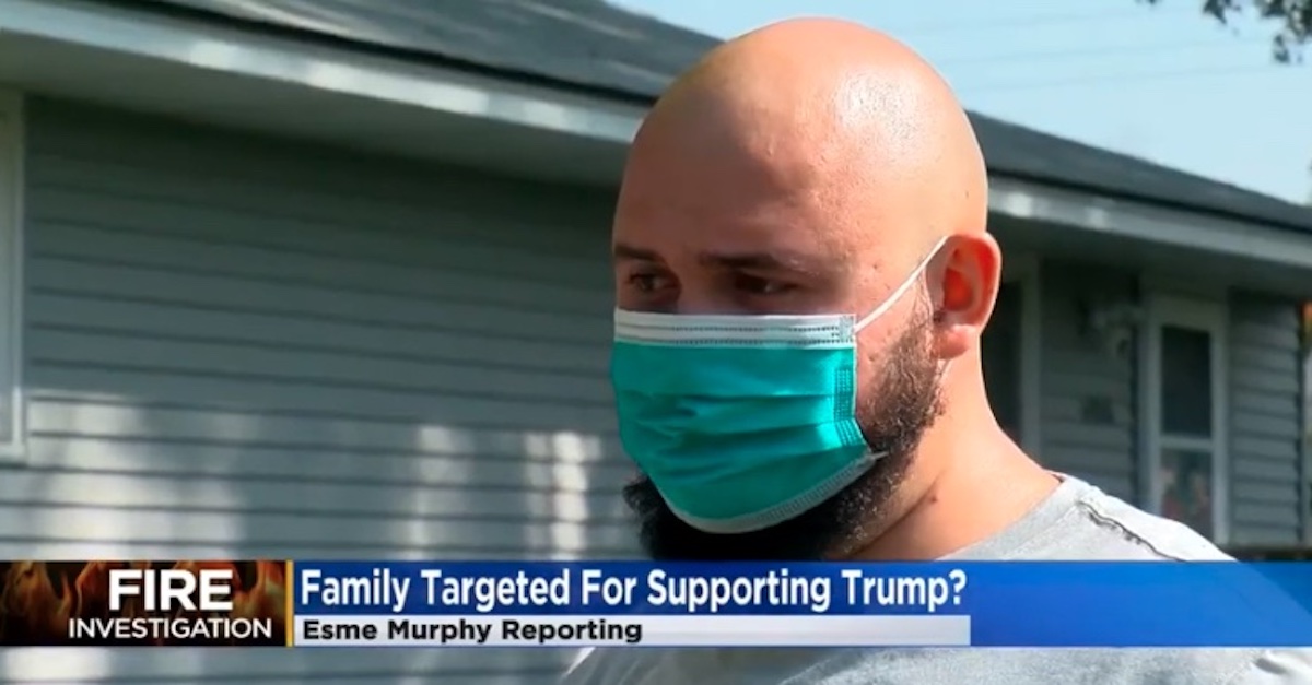 Dennis Molla gives an interview to Minneapolis CBS affiliate WCCO on Sept. 23, 2020, after he claimed his garage and trucks were burned because of pro-Trump flags on his property. In July 2022, Molla was charged with wire fraud, and federal authorities say he set the fires in an effort to defraud his insurance company.