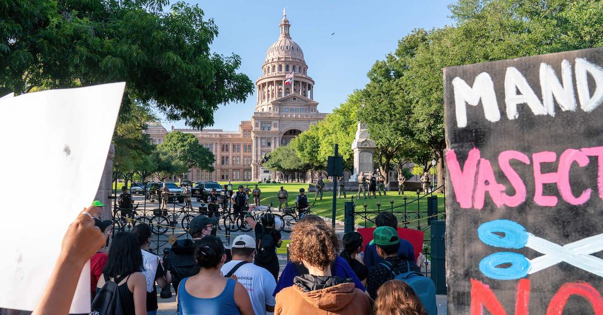 Abortion rights demonstrators gather near the State Capitol in Austin, Texas, June 25, 2022. (Photo by Suzanne Cordeiro/AFP via Getty Images.)