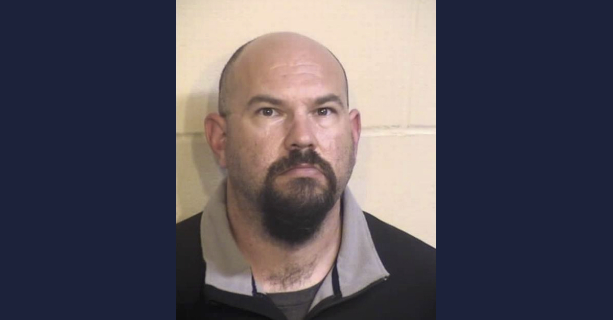 Brent Cox appears in a mugshot