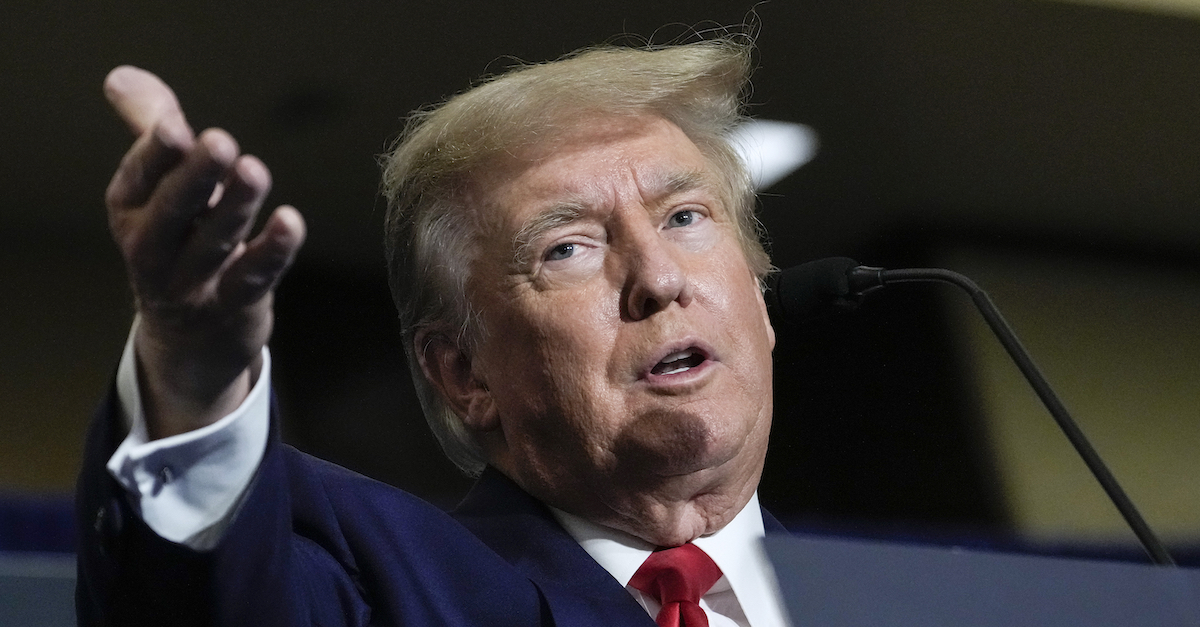 A photograph shows Donald Trump gesturing during a speech.