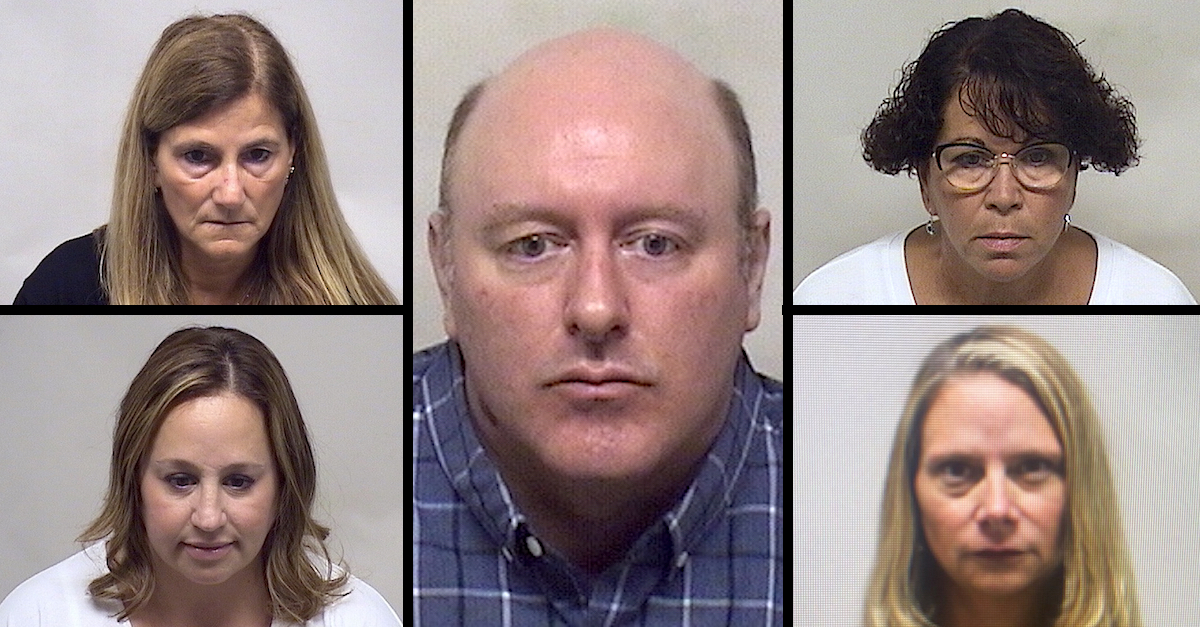 A collection of charged educators appear in police booking photos.
