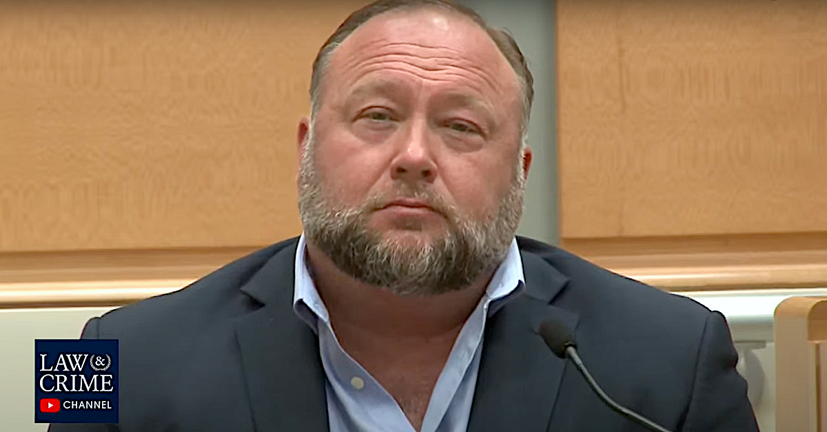 Alex Jones appears seated in a witness chair.