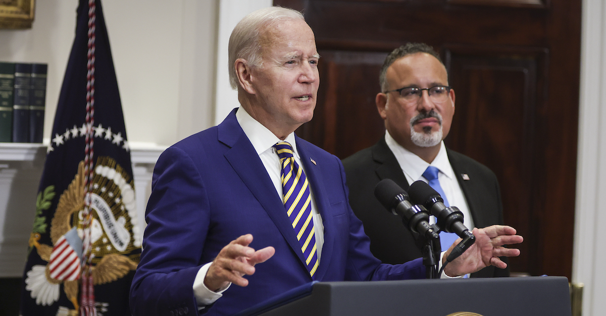 Joe Biden and Education Secretary Miguel Cardona appear in a photo.