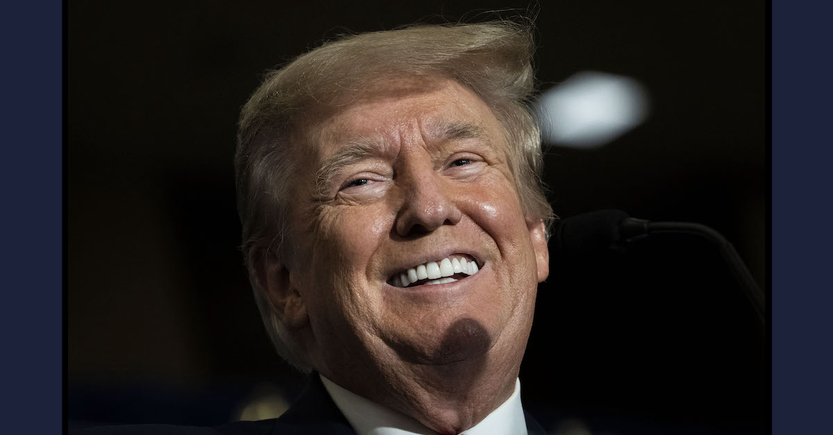 A photo shows Donald Trump smiling.