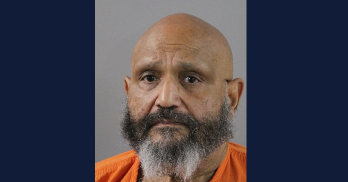 Gino Colonacosta, bald/shaved head and grey/black beard, appears in a booking photo (via Polk County (Fla.) Sheriff
