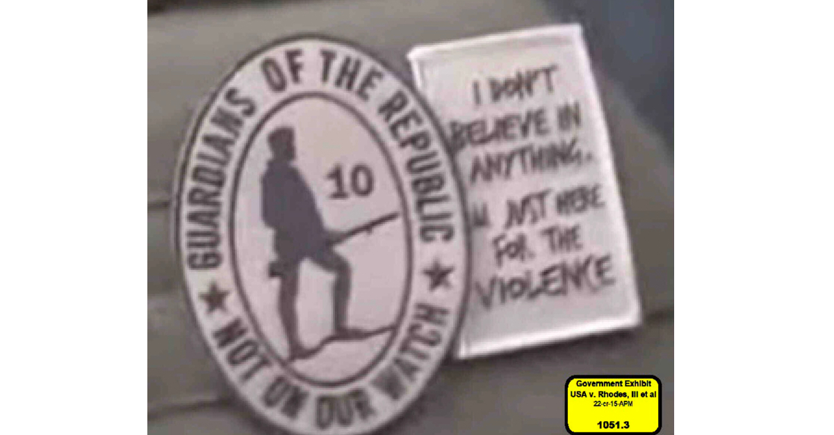 Two patches are pictured: one with an image of a silhouetted person appearing to hold a rifle, with the phrase "Guardians of the Republic" and "Not On Our Watch." A second patch says: "I don't believe in anything, I'm just here for the violence."