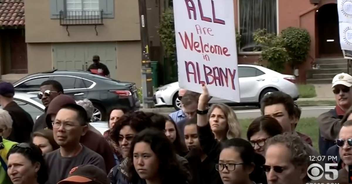 Families of Albany High School students rally after racist Instagram posts were discovered to have circulated on campus.