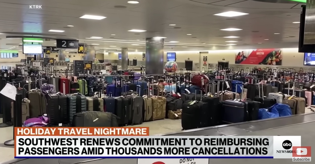 Suitcases are lined up at an airport following mass cancellations and delays by Southwest Airlines in late December 2022.