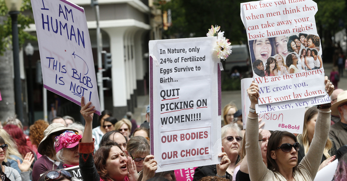 FILE - In this May 21, 2019 file photo, people rally in support of abortion rights at the Capitol in Sacramento, Calif. Gov. Gavin Newsom signed a measure, on Friday, Oct. 11,2019, that will require public colleges and universities to offer abortion medication at campus health centers. 