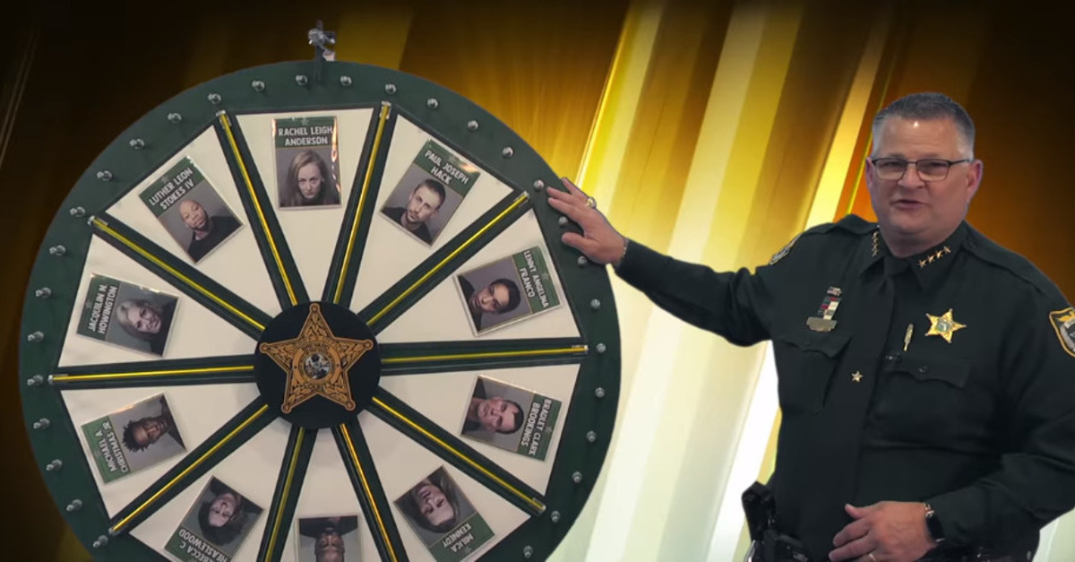 Broward County Sheriff Wayne Ivey is shown spinning the 'Wheel of Fugitive' in a social media post.
