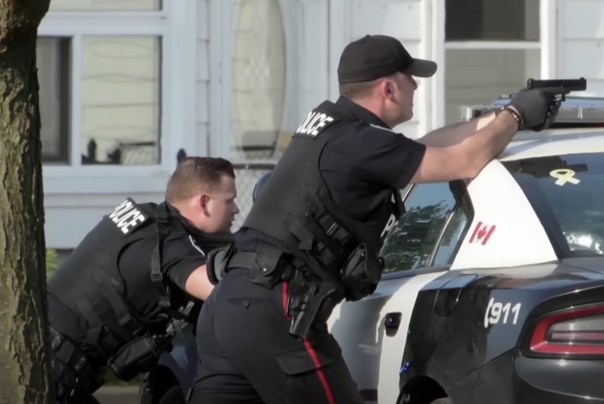 HPS officers during the multi-hour standoff with the suspected murder (CBC News screenshot)