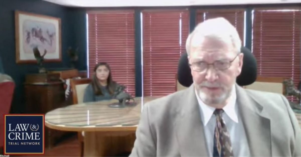 Defense attorney Gary C. Mitchell appears in the foreground; seated behind him is is client, Alexee Trevizo