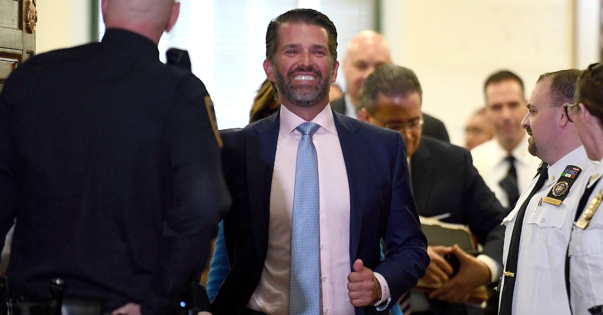 Donald Trump Jr leaves court with a smile on his face 