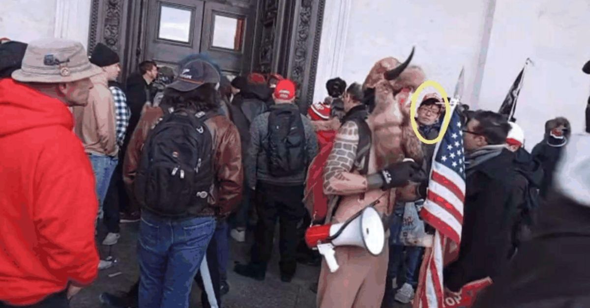 A photo from Jan. 6, 2021 outside of the U.S. Capitol shows defendant Alexander Fan, circled in yellow, looking at the camera as rioters swarm to enter. Notably in front of fan is Jan.6 rioter,Jacob Chansley. 