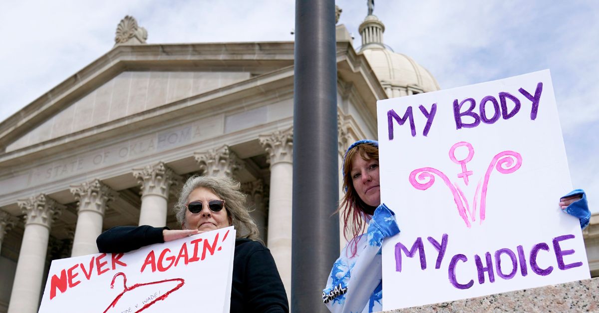 Protesters hold pro-choice signs at the state Capitol in Oklahoma City 2022. (AP Photo/Sue Ogrocki)
