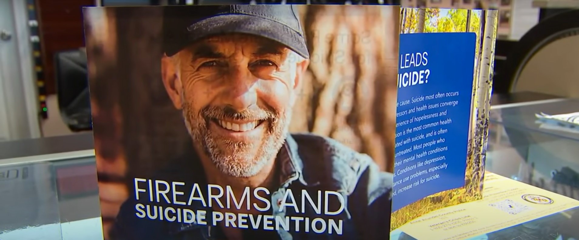 A suicide prevention pamphlet required to be distributed by gun sellers in Maryland is not a violation of First Amendment rights, the Fourth Circuit ruled in Jan. 2024. Pamphlet on merchant counter image courtesy YouTube screengrab Washington, D.C. Fox affiliate WTTG.