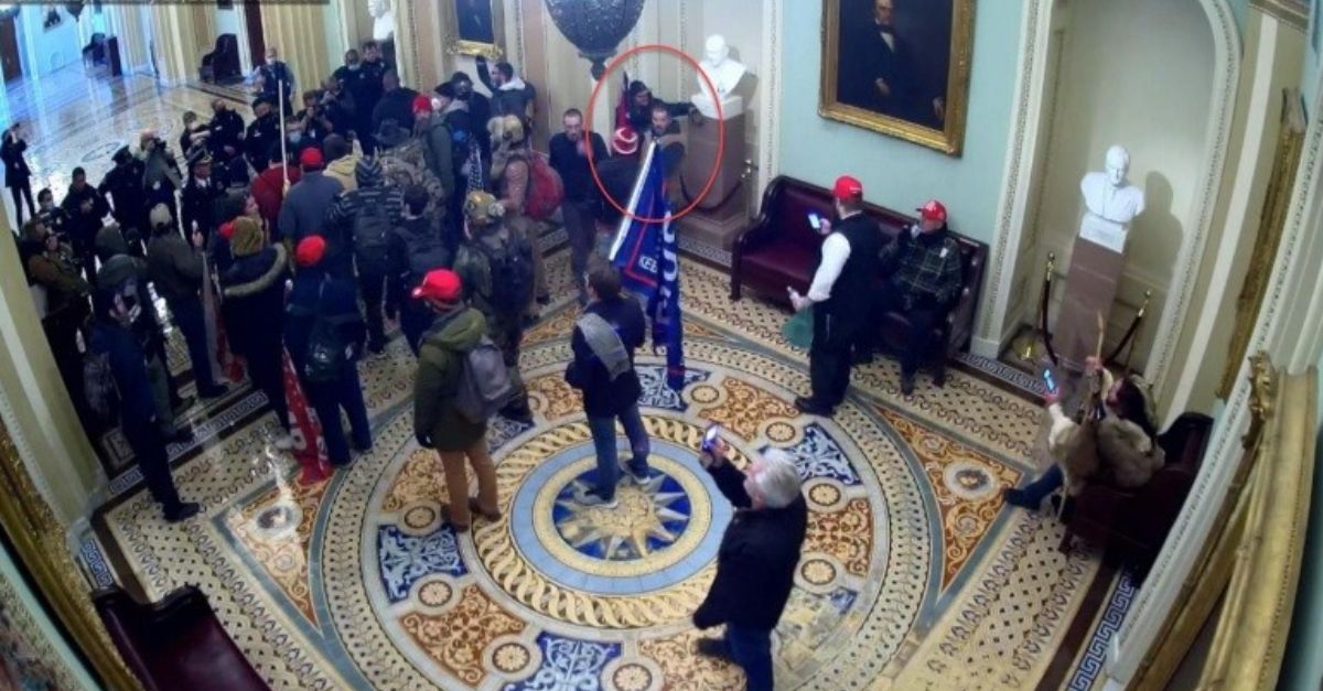 Circled in red, Hunter Seefried says he hung back on Jan. 6 and stayed near a bust, not posing a "credible threat of violence." Photo courtesy of court records in evidence.