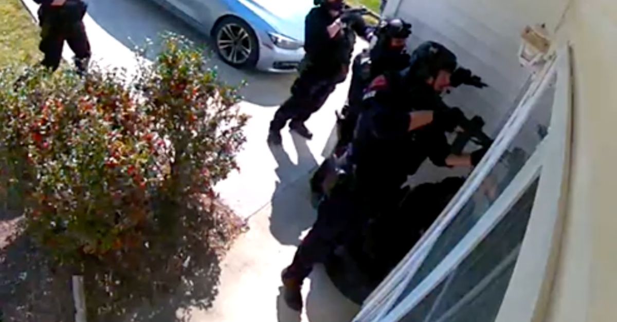 Raleigh police officers are seen in home surveillance footage raiding the home of Amir Abboud in 2021. (Screenshot courtesy of Abboud