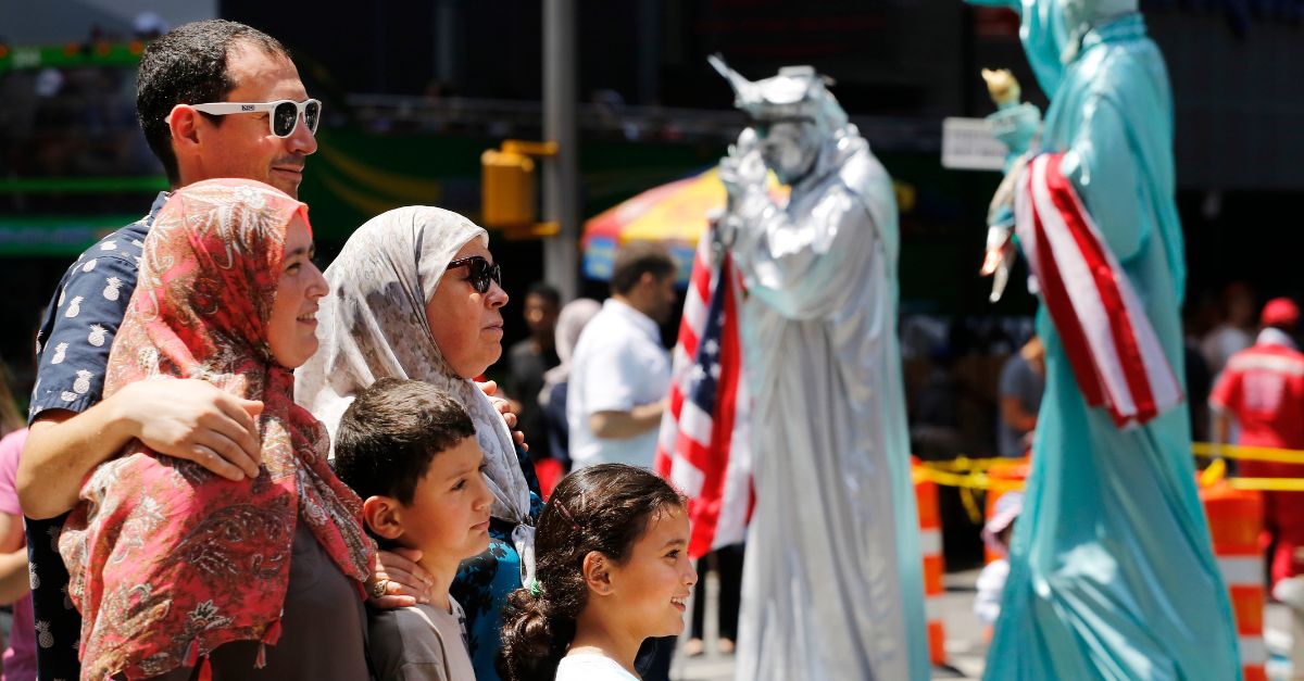 A Muslim family poses for photos, Sunday, July 17, 2016, in New York