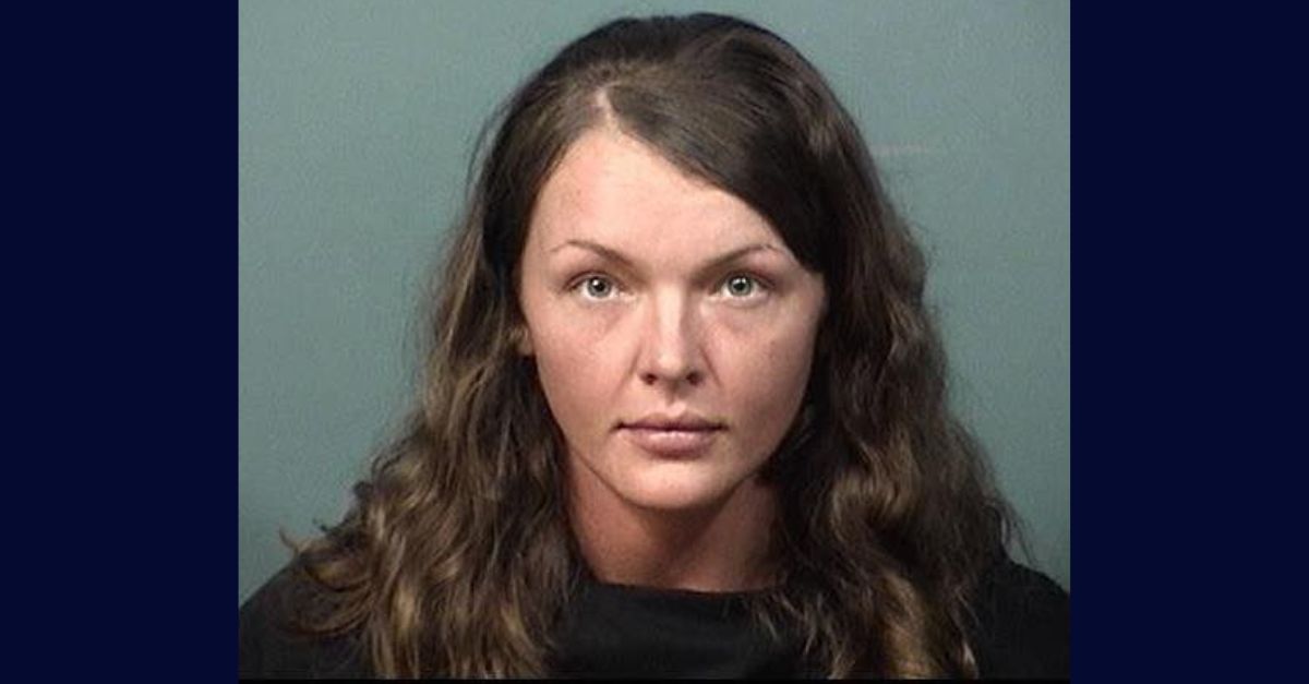 Heather Nelson appears in a booking photo.