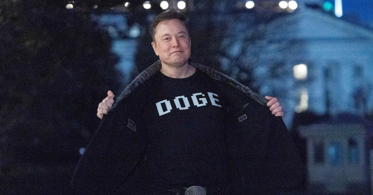 Elon Musk flashes his t-shirt that reads "DOGE" to the media arsenic  helium  walks connected  South Lawn of the White House, successful  Washington, Sunday, March 9, 2025. (AP Photo/Jose Luis Magana) 