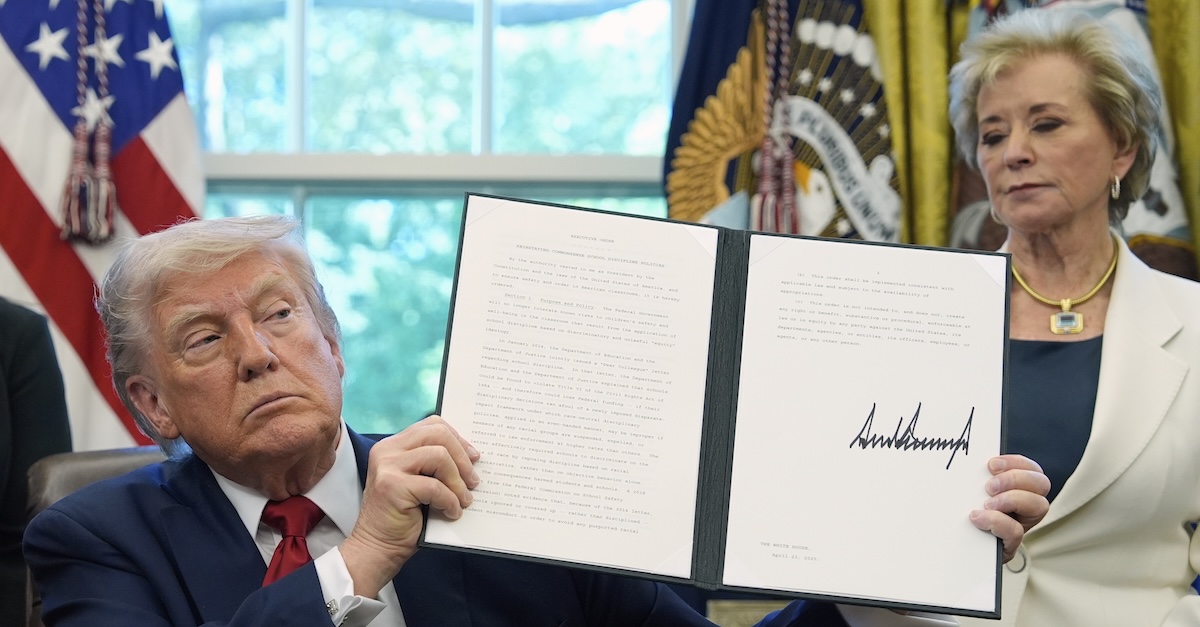 President Donald Trump holds a signed an enforcement  bid   relating to schoolhouse  subject  policies arsenic  Education Secretary Linda McMahon listens successful  the Oval Office of the White House, Wednesday, April 23, 2025, successful  Washington (AP Photo/Alex Brandon).