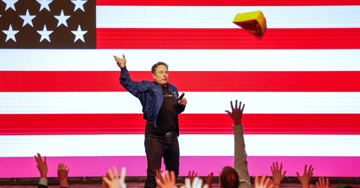 Elon Musk tosses a cheesehead during a town hall Sunday, March 30, 2025, in Green Bay, Wisconsin (AP Photo/Jeffrey Phelps).