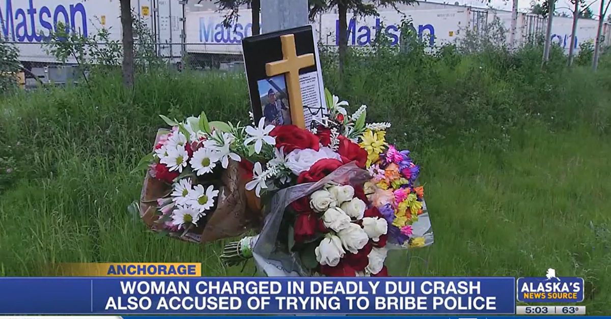 A woman allegedly tried to bribe police after fatally hitting a cyclist while drunk