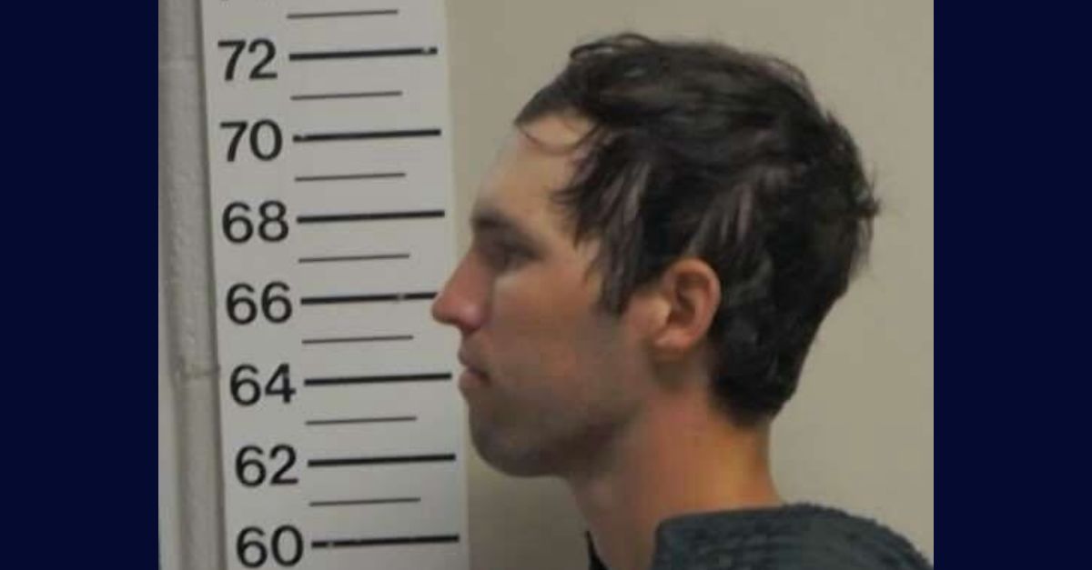 Tyler Robinson appears in a booking photo in profile.