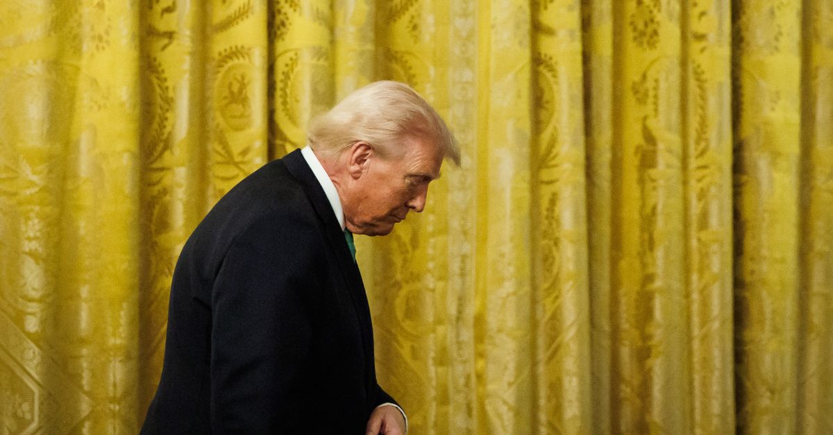 Donald Trump looks down.