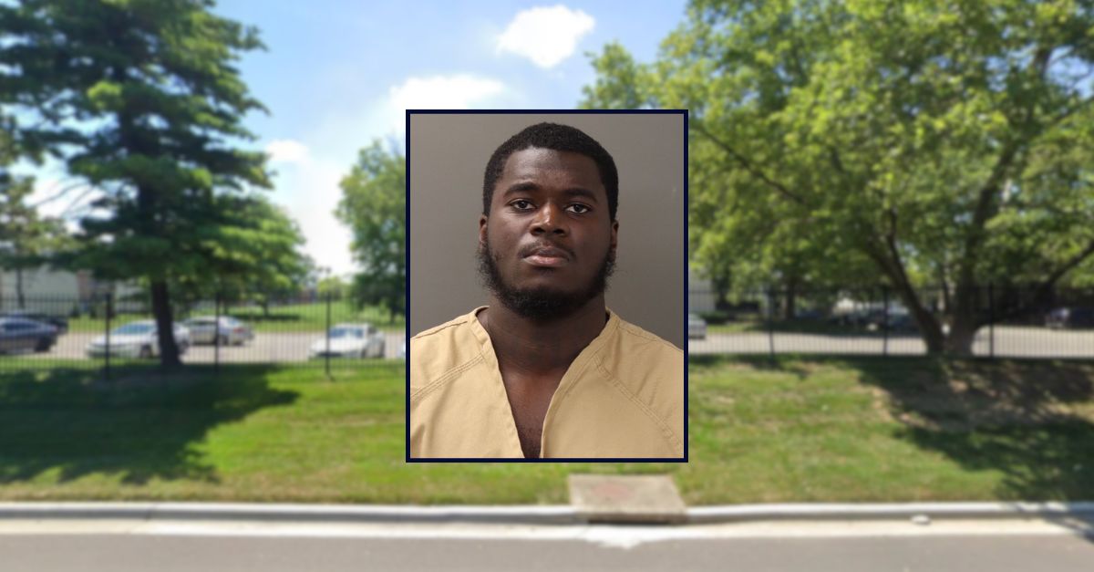 Jermal Dequan Freeman appears in a booking photo inset against an image of an apartment complex in Ohio.